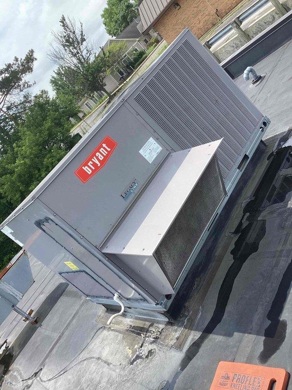 Completed scheduled commercial cooling maintenance on rooftop Bryant HVAC unit. Inspected condenser coil, refrigerant lines, and electrical components for proper operation. Documented current condition of four KOCH brand air filters in 2x2 configuration showing moderate dust accumulation; filters remain serviceable but will require replacement at next interval to maintain optimal airflow and system efficiency.