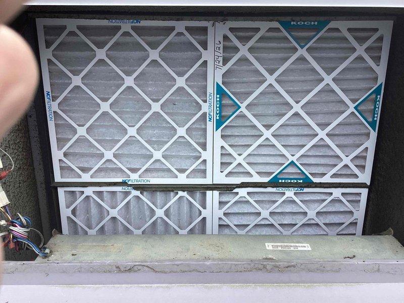 Completed scheduled commercial cooling maintenance on rooftop Bryant HVAC unit. Inspected condenser coil, refrigerant lines, and electrical components for proper operation. Documented current condition of four KOCH brand air filters in 2x2 configuration showing moderate dust accumulation; filters remain serviceable but will require replacement at next interval to maintain optimal airflow and system efficiency.