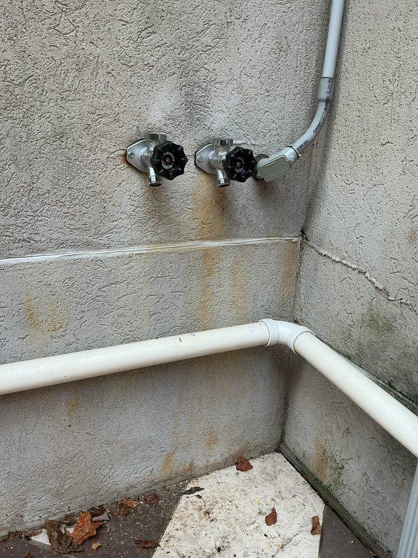 Responded to service call for two malfunctioning anti-freeze spigots located in separate areas accessible through drop ceiling. Inspected both frost-free hose bibs mounted on exterior wall with gray PVC supply lines and copper piping infrastructure visible in ceiling cavity. Verified proper operation of shutoff valves with blue handles on copper supply lines. Repaired and tested both anti-freeze spigots to ensure proper drainage function and freeze protection capability. Confirmed all connections secure and leak-free at both locations.