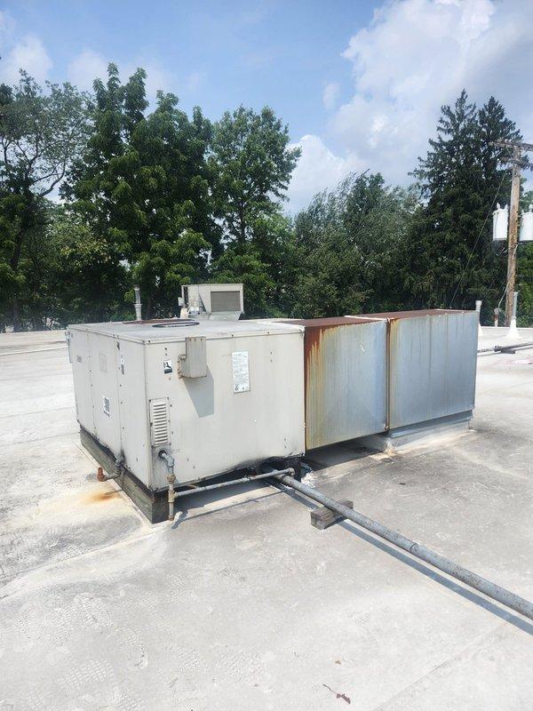 Responded to service call for two rooftop units experiencing operational issues, with one unit affected by lightning strike and the other performing below capacity. Inspected electrical disconnect box on lightning-affected unit, finding evidence of weathering, corrosion, and compromised fuse assembly with visible deterioration throughout the enclosure. Assessed both RTU systems on commercial rooftop, documenting equipment condition and identifying necessary repairs to restore proper operation.