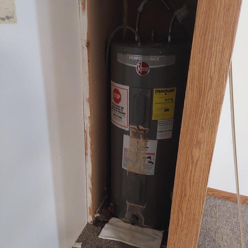 Completed comprehensive estimate for replacement of existing Rheem Performance water heater and furnace system in residential utility closet. Both units showing signs of age and wear, with visible corrosion and debris accumulation at water heater base. Documented current equipment specifications, condition, and installation parameters including clearances, venting configuration, and copper supply lines. Provided homeowner with detailed replacement options for upgrading to high-efficiency equipment that meets current code requirements and improves overall system performance.