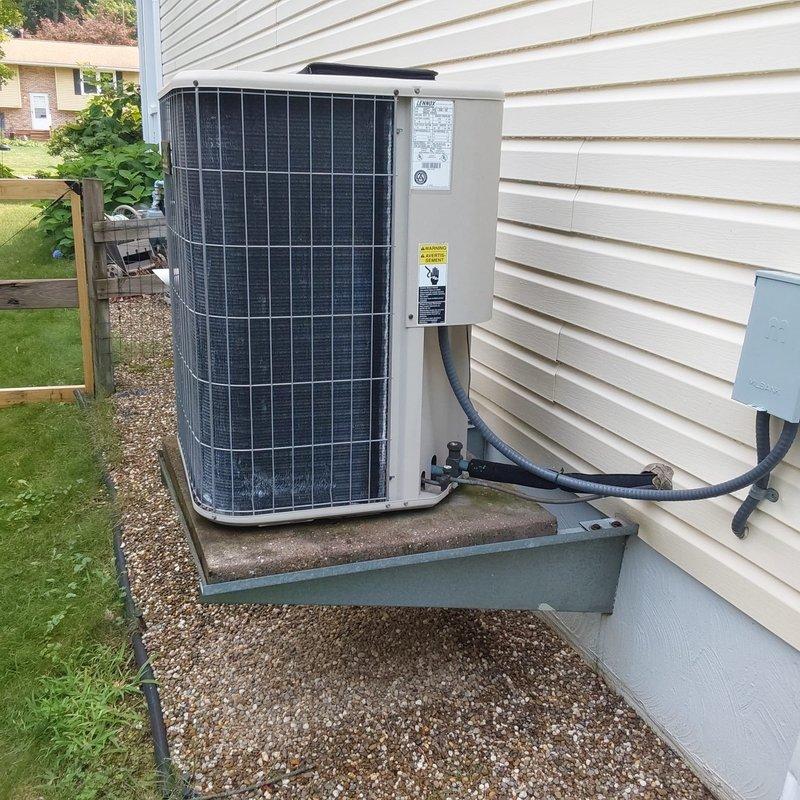 Completed full HVAC system retrofit including furnace and air conditioning replacement. Installed new outdoor condenser unit on existing concrete pad with proper refrigerant line routing through exterior wall, and replaced indoor air handler in basement mechanical room. All equipment properly positioned, connected, and tested for optimal operation.