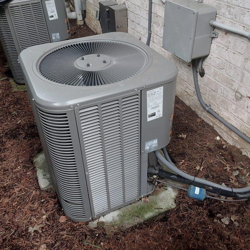Completed full HVAC system retrofit including outdoor condenser unit and indoor Lennox furnace installation. Positioned new condenser on concrete pad blocks with proper clearance from building, installed refrigerant line set with secure fastening, and ran electrical conduit to wall-mounted junction box. Inside mechanical room, installed new Lennox furnace with complete PVC venting system, condensate drainage piping, and electrical connections to code-compliant control panels.
