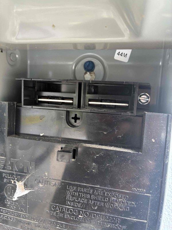 Responded to no cooling complaint on commercial mini-split system. Inspected interior components of outdoor condensing unit, including refrigerant lines, electrical connections, and disconnect panel. Verified proper electrical supply at Eaton CH-series disconnect switch and examined refrigerant line insulation for integrity. Unit inspected and assessed for cooling system functionality.
