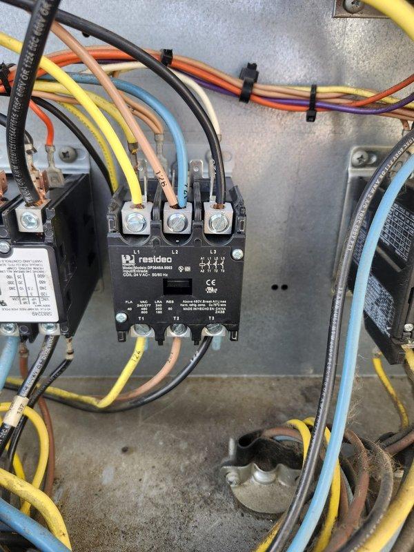 Responded to complaint of inadequate cooling on RTU with recently replaced compressor. Upon inspection, discovered failed contactor preventing proper compressor operation. Replaced defective Resideo contactor with new Eaton Cutler-Hammer C25DND330 30A rated contactor, properly terminated all electrical connections including power feeds and control wiring, and verified proper operation of compressor circuit. Unit tested and confirmed cooling performance restored to normal operating parameters.
