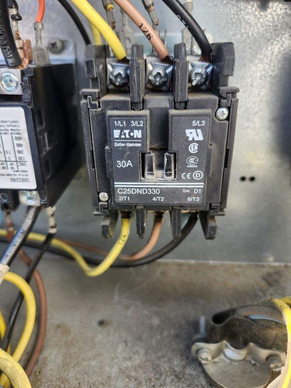 Responded to complaint of inadequate cooling on RTU with recently replaced compressor. Upon inspection, discovered failed contactor preventing proper compressor operation. Replaced defective Resideo contactor with new Eaton Cutler-Hammer C25DND330 30A rated contactor, properly terminated all electrical connections including power feeds and control wiring, and verified proper operation of compressor circuit. Unit tested and confirmed cooling performance restored to normal operating parameters.