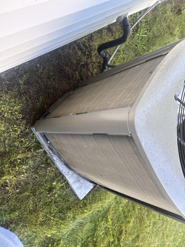 Responded to no cooling complaint and found outdoor condenser coil heavily clogged with leaves, dirt, and organic debris restricting airflow. Cleaned condenser coil, restored proper airflow, and verified system pressures and temperatures returned to normal operating range. Unit now cooling properly.