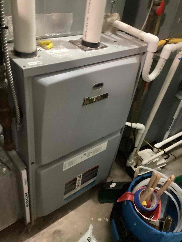 Completed scheduled commercial cooling maintenance visit per contract requirements. Performed comprehensive inspection of indoor furnace unit and outdoor condenser unit. Verified proper operation of all HVAC system components, checked refrigerant levels, inspected electrical connections, and confirmed adequate airflow through both units. Documented equipment condition with photographs showing furnace installation in mechanical room and outdoor condenser unit positioned on concrete pad with proper clearances maintained.