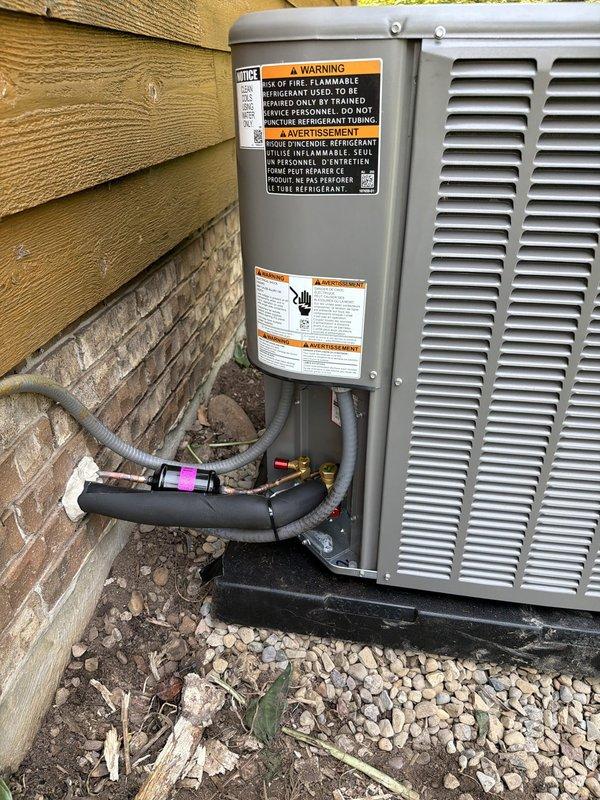 Completed replacement of outdoor air conditioning condenser unit and indoor evaporator coil for residential HVAC system. Installed new equipment utilizing existing refrigerant lineset, ensuring proper connection of insulated refrigerant lines with appropriate service port access. System was charged with R-454B refrigerant and commissioned to manufacturer specifications, with final operational readings confirming low side pressure at 134.4 PSI, high side pressure at 286.9 PSI, superheat at 14.8°F, and subcooling at 8.0°F, all within acceptable operating parameters for optimal system performance.