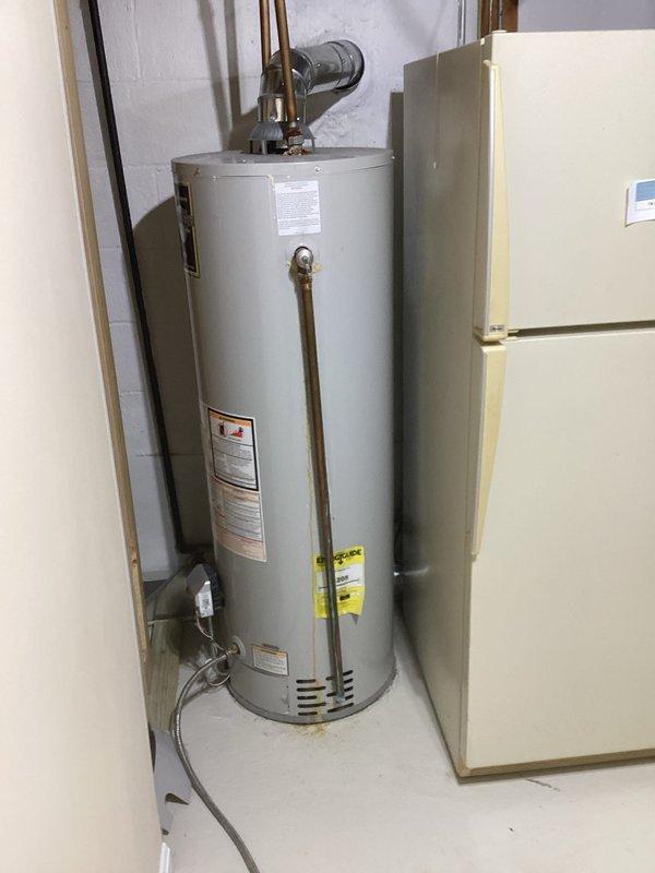Installed a new 40-gallon tall Bradford White gas water heater in utility room, including all necessary copper piping connections, expansion tank, pressure relief valve, and proper venting components. Unit was delivered from SupplyHouse and successfully installed with all plumbing connections tested and verified for proper operation.