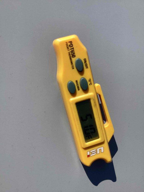 Completed scheduled commercial cooling maintenance visit. Performed system diagnostics and temperature measurements using calibrated digital thermometer, verifying proper refrigerant temperatures and system performance parameters to ensure equipment operating within manufacturer specifications.
