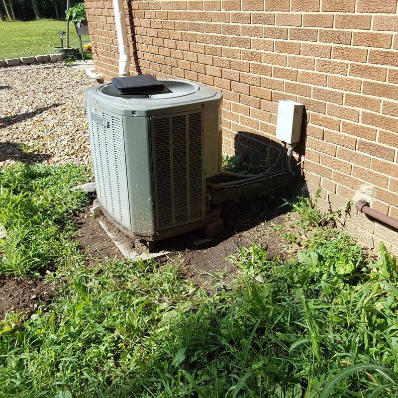 Completed comprehensive HVAC system evaluation for new customer requiring AC replacement with potential furnace upgrade. Assessed existing Carrier heating system and Space-Gard air filtration unit in basement utility area, along with outdoor condenser unit positioned on concrete pad against exterior brick wall. Coordinated with technician performing furnace tune-up and inspection to provide complete system replacement estimate covering both cooling and heating equipment needs.
