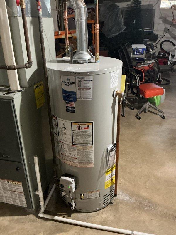 Responded to customer complaint regarding odor emanating from water heater. Customer approved replacement of existing anode rod with odor-reducing nano-rod to eliminate sulfur smell caused by bacteria interaction with standard magnesium anode. Coordinated part delivery and scheduled replacement of anode rod in Bradford White residential water heater unit located in basement mechanical room. Documented existing water heater installation and plumbing connections prior to service completion.
