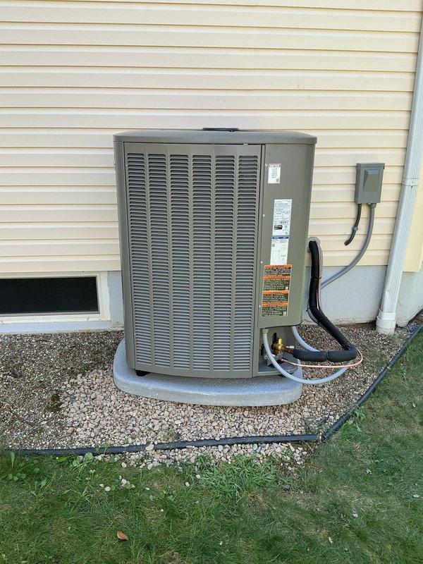 Completed full HVAC system retrofit including new furnace and air conditioning condenser installation. Removed existing equipment and installed replacement furnace in basement mechanical room with proper venting using white PVC exhaust piping. Mounted new outdoor condensing unit on concrete pad with gravel base and appropriate clearances from structure. Connected refrigerant lines between indoor and outdoor components using insulated copper lineset. Installed electrical disconnect box at exterior location per code requirements. Verified all electrical connections, tested system operation, and confirmed proper airflow and temperature differentials across both heating and cooling modes.