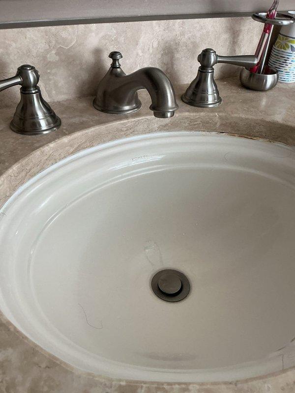 Responded to service call for two separate sink issues in residential property. First location: master bedroom bathroom sink experiencing repeated drainage problems. Removed and cleaned faucet aerator to restore proper water flow, which had become restricted due to mineral deposit buildup. Second location: upstairs office/suite bathroom sink with stuck pop-up drain stopper assembly. Disassembled and freed the stuck stopper mechanism, cleaned drain components, and reassured proper operation of both the stopper and drainage system. Both fixtures tested and confirmed operational upon completion.