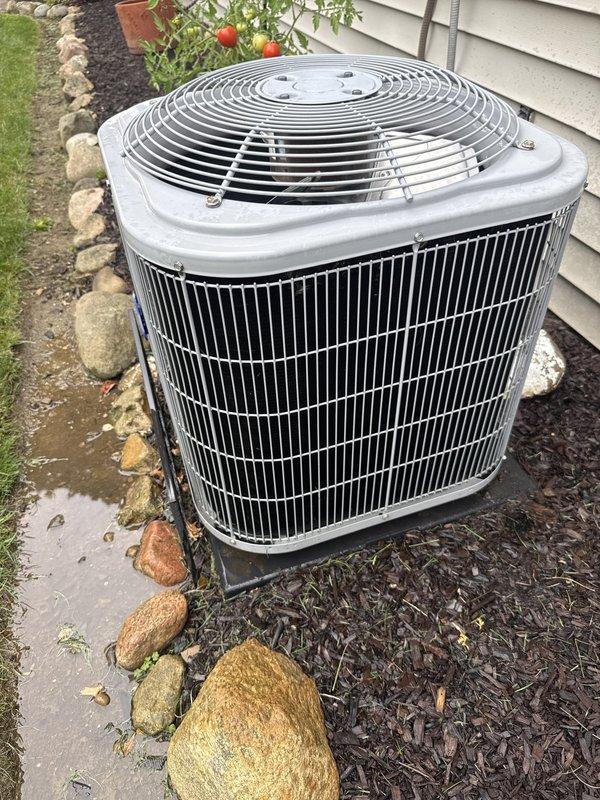 Completed routine cooling maintenance on a 14-year-old ground-level air conditioning system scheduled for 8 AM appointment. Performed comprehensive inspection of outdoor condenser unit, checked electrical connections and conduit mounting, verified proper fan operation, and assessed overall system condition. Unit is approaching replacement age and customer has been advised regarding renewal timeline.