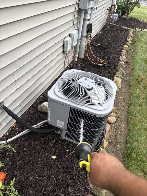 Completed routine cooling maintenance on a 14-year-old ground-level air conditioning system scheduled for 8 AM appointment. Performed comprehensive inspection of outdoor condenser unit, checked electrical connections and conduit mounting, verified proper fan operation, and assessed overall system condition. Unit is approaching replacement age and customer has been advised regarding renewal timeline.