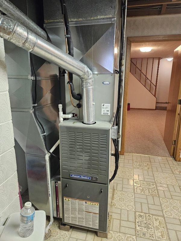 Responded to no cooling complaint on residential split system air conditioning unit. Upon arrival, accessed indoor furnace/air handler in basement and outdoor condensing unit. Connected manifold gauge set to service ports on outdoor unit to diagnose refrigerant pressures and system performance. Performed diagnostic testing to identify cause of insufficient cooling. System evaluated and appropriate corrective measures taken to restore proper cooling operation.