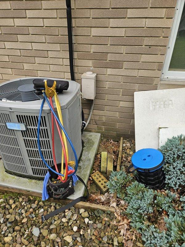 Responded to no cooling complaint on residential split system air conditioning unit. Upon arrival, accessed indoor furnace/air handler in basement and outdoor condensing unit. Connected manifold gauge set to service ports on outdoor unit to diagnose refrigerant pressures and system performance. Performed diagnostic testing to identify cause of insufficient cooling. System evaluated and appropriate corrective measures taken to restore proper cooling operation.