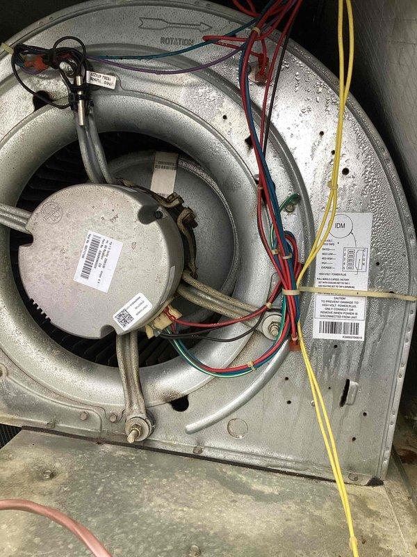 Responded to water leak complaint at diffuser. Upon inspection, found evidence of significant condensation and moisture accumulation on blower assembly and surrounding components. Documented conditions with photos showing water droplets on blower housing and moisture staining on ductwork. System appears to have drainage or insulation issue causing condensate to reach diffuser instead of draining properly through designated drain lines.