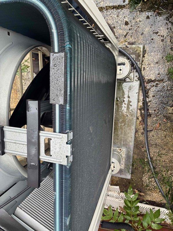 Responded to service call for 15-year-old mini split system experiencing immediate shutdown after startup. Upon arrival, performed diagnostic inspection of both indoor and outdoor units. Examined interior evaporator components, air distribution grid, and housing for obstructions or mechanical failures. Inspected outdoor condensing unit mounted on concrete pad, checking electrical conduit connections, refrigerant lines, and overall system integrity. Documented equipment condition through photographic evidence showing normal component wear consistent with system age. Unit operational status assessed and customer contacted en route as requested.