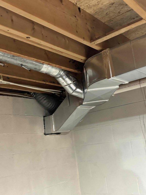 Completed rough-in HVAC ductwork installation for new construction addition, including flexible and rigid metal duct runs for rear addition spaces, storage room off garage, bedroom, and garage heater. Installed metallic flex duct through ceiling joists and sheet metal plenum transitions, properly secured all ductwork to framing members, and coordinated routing to avoid interference with structural elements and electrical systems.