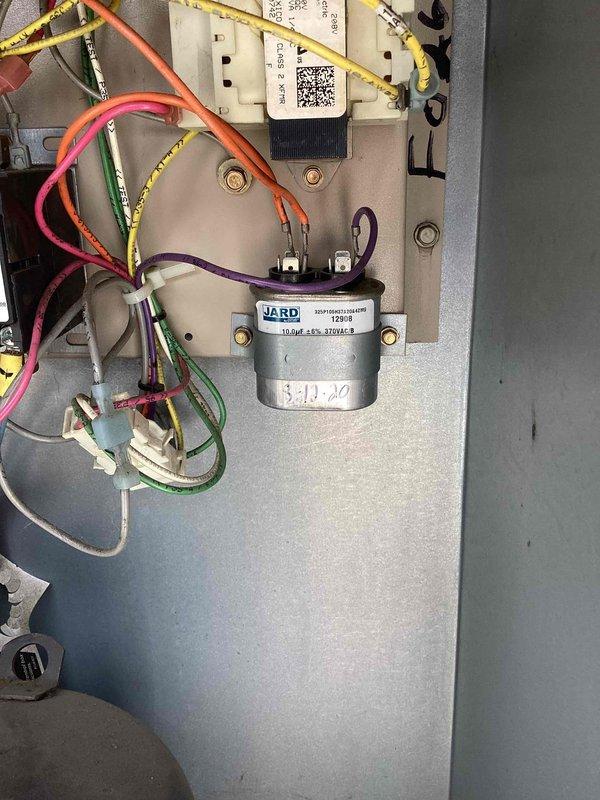 Responded to callback for Lennox rooftop package unit that was inoperative following previous service visit. Upon arrival, unit would not power on. Inspected electrical components and identified failed JARD capacitor. Replaced defective capacitor, verified proper wire connections and terminal integrity, and restored unit to full operation with normal startup sequence confirmed.