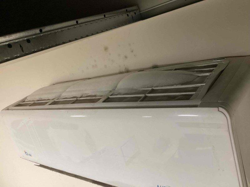 Responded to callback for wall-mounted AC unit with recurring cooling issue from previous month. Upon inspection, found unit operational but delivering insufficient cool air, consistent with reported symptoms. Performed diagnostic testing of indoor evaporator coil, refrigerant levels, and electrical connections at outdoor disconnect panel. Documented existing water staining above indoor unit indicating potential condensate drainage concerns that may be contributing to performance issues.