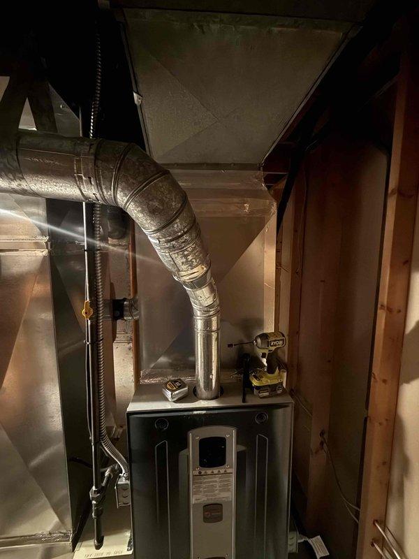 Performed dye search inspection on HVAC system to identify potential refrigerant leak. Inspected furnace unit, ductwork, and refrigerant lines in basement mechanical room using UV dye detection method, documenting findings with photographs of equipment and copper piping installations for further analysis.