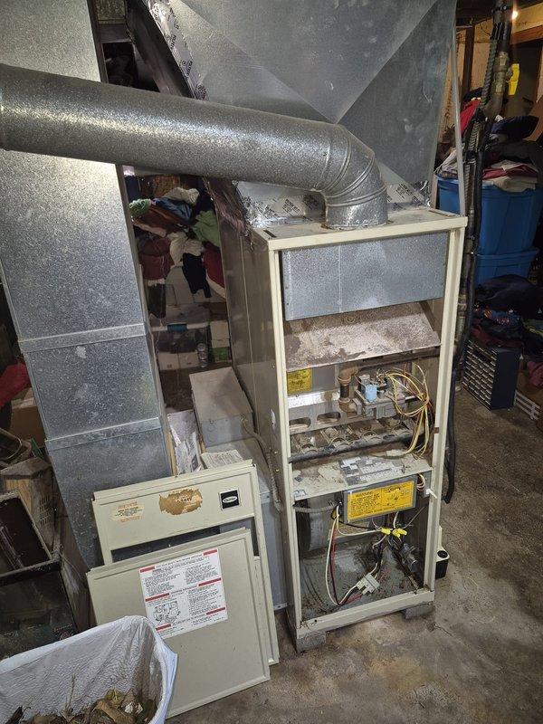 Responded to service call for A-frame coil water leak, frozen refrigerant line, and inoperative blower fan. Upon arrival, discovered frozen evaporator coil and suction line due to restricted airflow. Removed furnace access panel to inspect internal components and airflow path. Found dirty blower assembly and restricted air filter causing inadequate air circulation across evaporator coil, leading to freeze-up condition. Thawed frozen coil and refrigerant lines. Cleaned blower wheel and housing to restore proper airflow. Replaced air filter with correct size. Inspected condensate drain system and cleared blockage causing water leakage at A-frame coil. Verified blower motor operation and capacitor functionality. Cycled system through complete cooling operation to confirm proper airflow, temperature differential, and condensate drainage. System restored to normal operating condition with no further leaks or freeze-up issues observed.