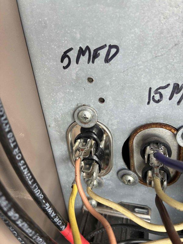 # Commercial HVAC Condenser Unit Repair

Responded to a commercial HVAC service call for a non-operational condenser unit. Upon inspection, diagnosed a failed condenser fan motor that prevented proper heat rejection from the refrigeration cycle. The motor showed signs of electrical failure and would not operate when power was applied to the unit.

## Work Performed

Disconnected power to the unit and locked out the electrical service for safety. Removed the failed condenser fan motor from the unit along with the damaged fan blade. Inspected the existing run capacitor and found it to be out of specification, which likely contributed to the motor failure. The contactor also showed signs of pitting and electrical wear on the contact points, indicating it was due for replacement.

Installed a new condenser fan motor with matching specifications to the original equipment. Mounted a new fan blade to the motor shaft, ensuring proper clearance from the condenser coil and housing. Replaced the 