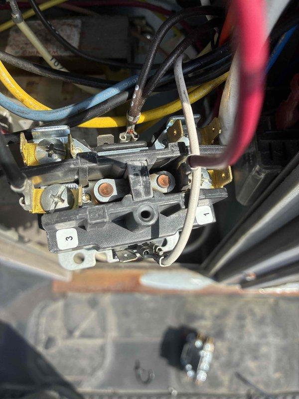# Commercial HVAC Condenser Unit Repair

Responded to a commercial HVAC service call for a non-operational condenser unit. Upon inspection, diagnosed a failed condenser fan motor that prevented proper heat rejection from the refrigeration cycle. The motor showed signs of electrical failure and would not operate when power was applied to the unit.

## Work Performed

Disconnected power to the unit and locked out the electrical service for safety. Removed the failed condenser fan motor from the unit along with the damaged fan blade. Inspected the existing run capacitor and found it to be out of specification, which likely contributed to the motor failure. The contactor also showed signs of pitting and electrical wear on the contact points, indicating it was due for replacement.

Installed a new condenser fan motor with matching specifications to the original equipment. Mounted a new fan blade to the motor shaft, ensuring proper clearance from the condenser coil and housing. Replaced the 
