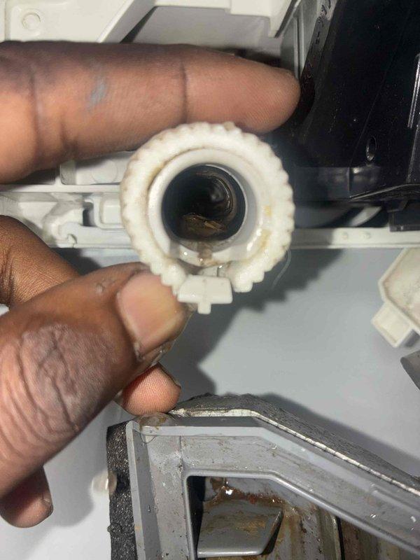 Responded to water leak complaint on breakroom mini-split system. Upon inspection, found clogged drain line causing condensate overflow from the indoor air handler unit. Removed and cleaned drain pump filter assembly, which showed significant sediment buildup and debris accumulation restricting proper drainage. Flushed drain line, reassembled components, and verified system operation with no further leakage detected.