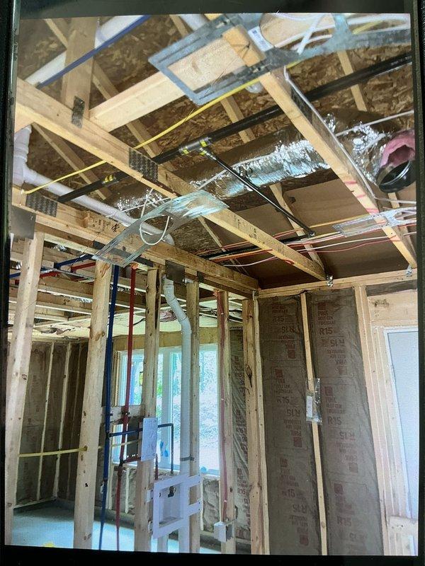 Installed new gas line to dryer location and extended existing gas line within newly constructed garage space. Work completed during rough-in phase of construction, with all gas piping routed through exposed framing and secured to structural members per code requirements.