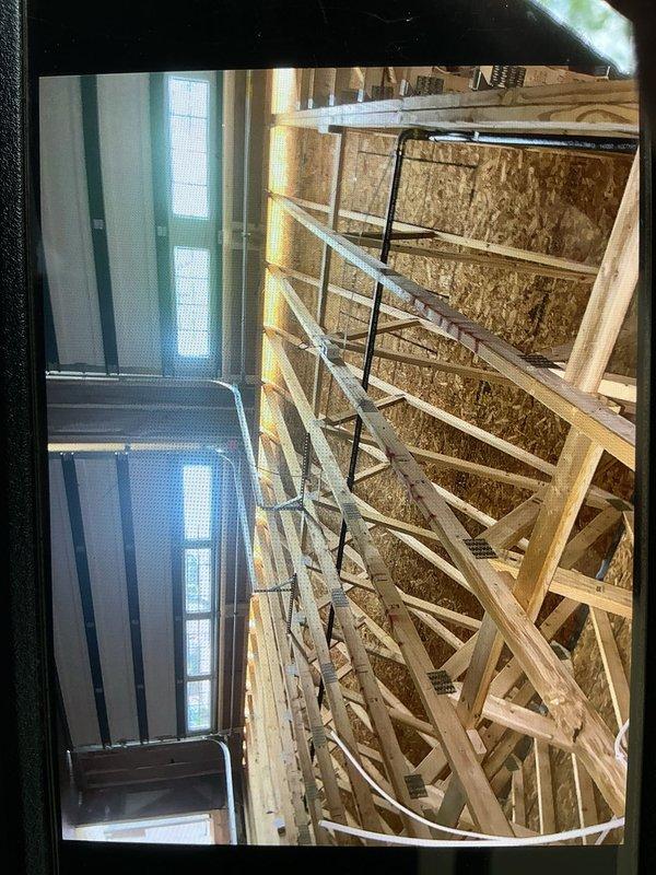 Installed new gas line to dryer location and extended existing gas line within newly constructed garage space. Work completed during rough-in phase of construction, with all gas piping routed through exposed framing and secured to structural members per code requirements.