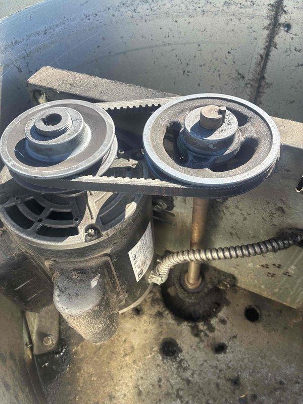 Responded to service call for commercial kitchen exhaust fan serving fryer equipment that was making loud noise before failing completely. Upon inspection, found belt-driven exhaust fan system with excessive dust and grease accumulation on pulleys, motor housing, and surrounding components. Diagnosed failed drive belt and worn pulley system as cause of operational failure. Cleaned mechanical assembly, replaced drive belt, inspected motor and pulley alignment, and verified proper tension. Tested system operation and confirmed exhaust fan running smoothly with no abnormal noise.