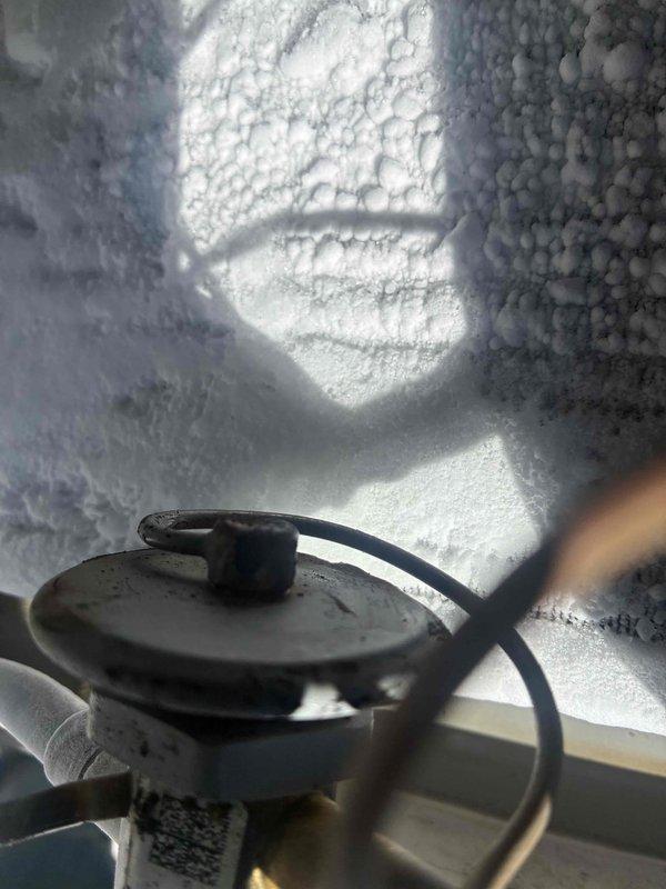Performed spring maintenance inspection on commercial HVAC unit experiencing operational issues. Upon inspection, discovered severe ice buildup throughout the evaporator coil and interior components, indicating restricted airflow or refrigerant system malfunction. Documented system temperatures using multi-probe digital thermometer, recording readings to assess cooling performance and diagnose root cause of icing condition. Recommended further evaluation of airflow restrictions, refrigerant charge levels, and potential metering device issues to restore proper system operation.