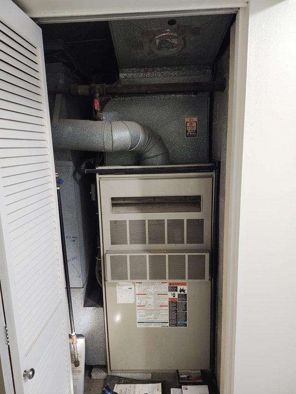 Completed furnace retrofit installation in utility closet with new high-efficiency unit and metallic ductwork connection. Installed chimney liner system through existing masonry structure to properly vent combustion gases, ensuring code compliance and safe operation. All HVAC components, including supply ductwork and venting infrastructure, were secured and tested for proper airflow and system functionality.