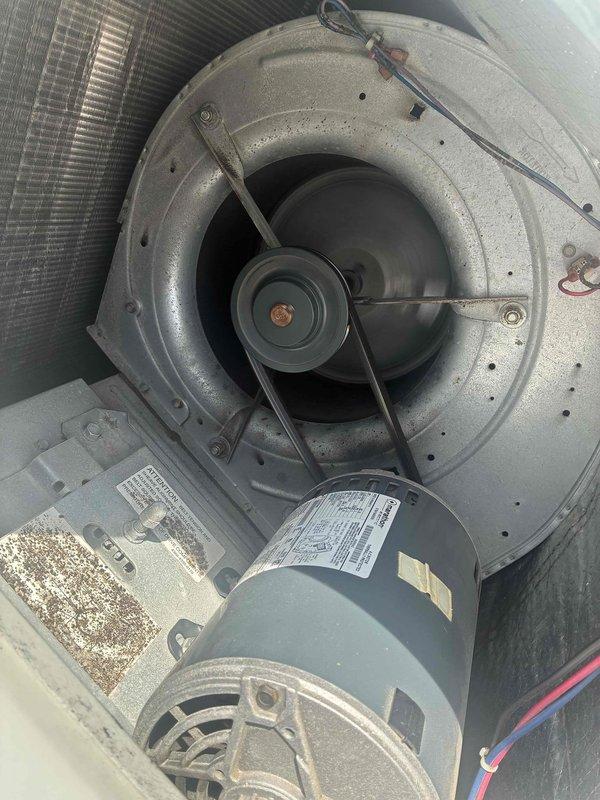 Completed scheduled commercial cooling maintenance on HVAC unit. Performed comprehensive inspection of blower assembly, motor, and electrical components. Inspected compressor, accumulator, refrigerant lines, contactors, and transformer for proper operation. All components found operating within normal parameters with standard dust accumulation noted on blower wheel and motor assembly.