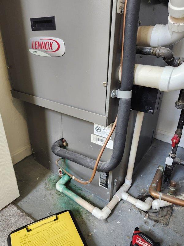 Completed retrofit installation of complete air conditioning system including outdoor condenser unit and indoor evaporator coil. Removed existing equipment and installed new Lennox system with proper refrigerant line sets, condensate drainage, and electrical connections. Outdoor condenser unit positioned on level pad adjacent to structure with line set routed through exterior wall via protected conduit. Indoor air handler installed in mechanical room with copper refrigerant lines, insulated suction line, PVC condensate drain piping, and all necessary shut-off valves. System tested for proper operation, refrigerant charge verified, and all connections inspected for leaks. Installation meets manufacturer specifications and local code requirements.