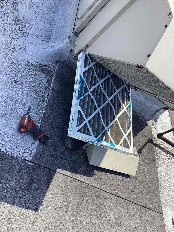 Completed scheduled commercial cooling maintenance visit on rooftop HVAC unit. Inspected system components and replaced two 20x20x2 Koch pleated air filters. Observed heavy frost accumulation on refrigerant line insulation, indicating potential low refrigerant charge or restricted airflow condition requiring further evaluation. Unit operational at time of service.