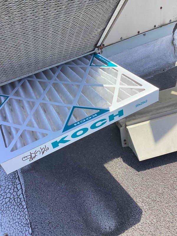 Completed scheduled commercial cooling maintenance visit on rooftop HVAC unit. Inspected system components and replaced two 20x20x2 Koch pleated air filters. Observed heavy frost accumulation on refrigerant line insulation, indicating potential low refrigerant charge or restricted airflow condition requiring further evaluation. Unit operational at time of service.