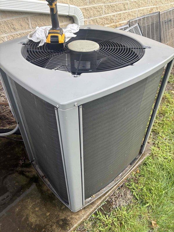 Completed routine commercial cooling maintenance on outdoor condensing unit. Performed diagnostic testing of dual-run capacitor using digital multimeter, confirming proper microfarad readings on 45+10 MFD capacitor rated at 440VAC. All electrical components tested within manufacturer specifications. Unit operating normally with no deficiencies noted.