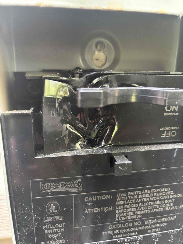 # HVAC Tune-Up Report

Performed routine maintenance tune-up on a one-year-old air conditioning system. During inspection, discovered significant electrical damage with charred and melted material around circuit breaker connections in the disconnect box, indicating heat damage or electrical arcing that poses a safety hazard. Removed and inspected the condensate drain pan, which showed normal wear with minor debris accumulation but remained structurally sound and functional.