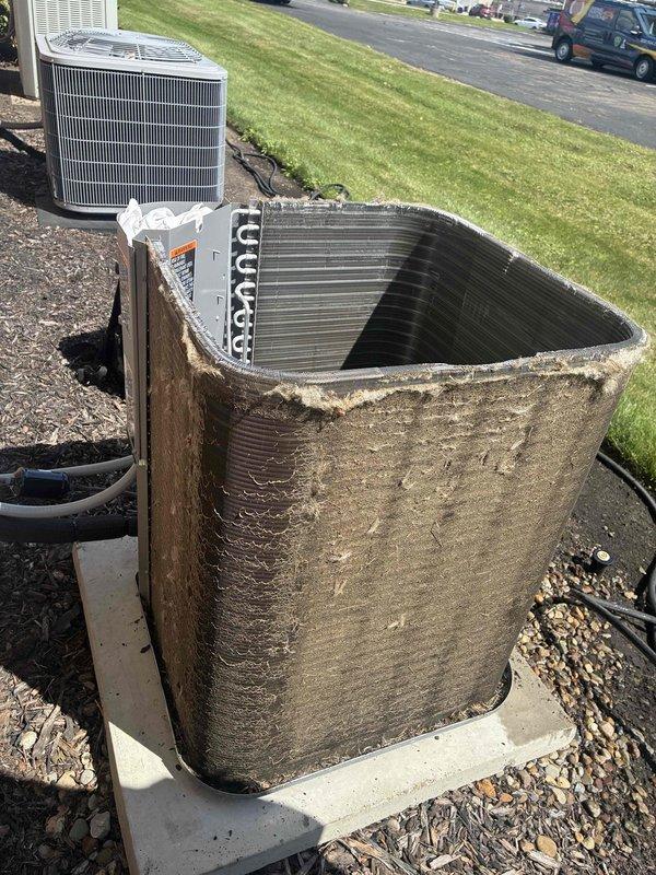Completed routine commercial cooling maintenance on multiple outdoor HVAC units. Performed thorough inspection and cleaning of heavily soiled condenser unit with significant dirt, dust, and debris accumulation on exterior surfaces and internal finned coil assembly. Removed caked-on grime from metal casing and corrugated panels. Inspected evaporator coils which displayed substantial clogging from dust, lint, and particulate matter buildup. Examined copper refrigerant lines for corrosion and proper connections. Verified electrical wiring connections and component functionality. Documented pre-service condition showing extreme dirt accumulation requiring deep cleaning to restore proper airflow and system efficiency.