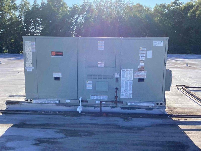 Responded to commercial property experiencing poor cooling conditions. Completed full rooftop unit replacement, installing new Trane commercial RTU system on existing roof curb assembly. Unit properly mounted on metal support frame with all electrical connections, refrigerant lines, and condensate drainage established through roof penetrations. System tested and operational, restoring full cooling capacity to facility.