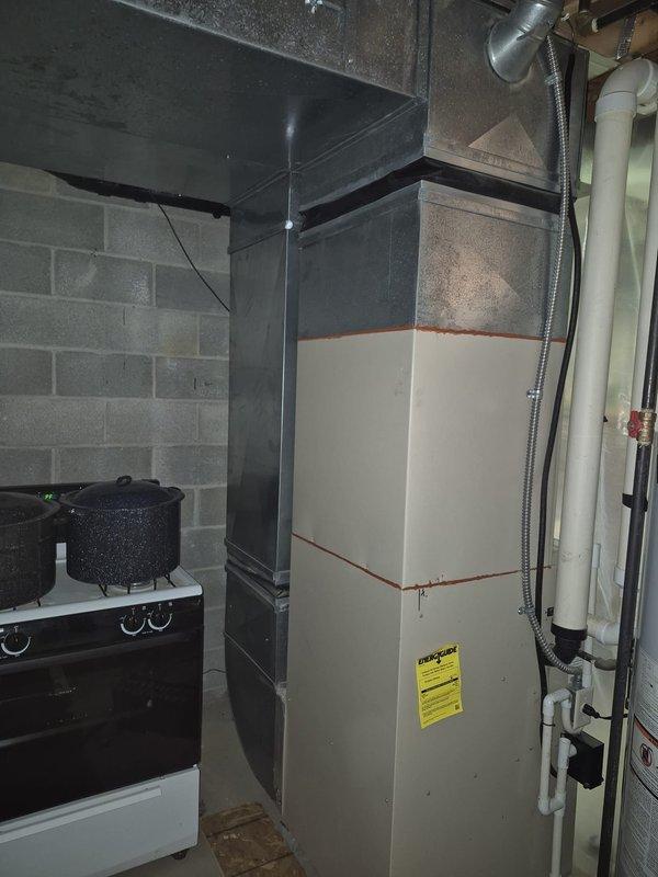 Responded to service call for 22-year-old air conditioning system not running. Upon arrival, performed diagnostic evaluation of outdoor condenser unit and indoor furnace system. Identified failed condenser fan motor as primary cause of system failure preventing compressor operation. Inspected electrical connections, capacitor, and contactor at outdoor unit. Reviewed system age and condition with customer, discussing repair versus replacement options given the advanced age of the equipment. Customer requested time to consider options before proceeding with fan motor replacement or full system replacement.