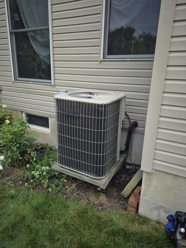 Responded to service call for 22-year-old air conditioning system not running. Upon arrival, performed diagnostic evaluation of outdoor condenser unit and indoor furnace system. Identified failed condenser fan motor as primary cause of system failure preventing compressor operation. Inspected electrical connections, capacitor, and contactor at outdoor unit. Reviewed system age and condition with customer, discussing repair versus replacement options given the advanced age of the equipment. Customer requested time to consider options before proceeding with fan motor replacement or full system replacement.