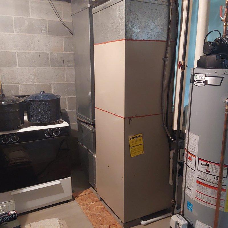 Completed AC retrofit installation in basement utility area. Installed new Lennox Elite Series furnace with proper refrigerant line connections and integrated condensate drainage system. Configured air handler with filter access and ensured all manufacturer specifications were met for optimal system performance.