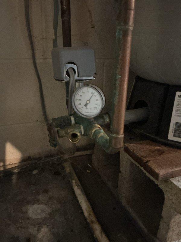 Installed a 40-gallon Bradford White tall water heater in the basement utility area, including all necessary copper piping connections and proper venting configuration. A pressure gauge was mounted on brass valve fittings to monitor system pressure, completing the installation to ensure safe and efficient operation of the new water heating system.